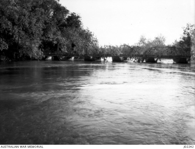 The camouflaged pontoon bridge, built by Australian Engineers across the Jordan River.