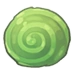 A large green circular stone with a faint spiral in the center.