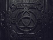 The door to the passage in Adam's world, reading "Sic Mundus Creatus Est"