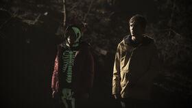 DARK Still 101 - Mikkel and Jonas in forest