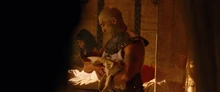 Menehptre holds his newborn son.