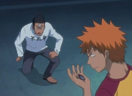 Isshin gives Ichigo a protective charm