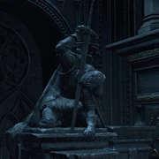The statue of a beheading knight inside the Cathedral of Lothric.