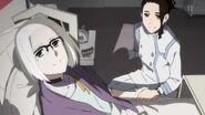 Adult Naomi with a bed stricken Ikuno