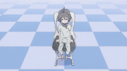 Young Zorome sits in a chair.