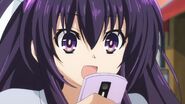 Tohka looking at her phone