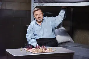 Stefano (Joseph Mascolo) in Jail with a chess board.