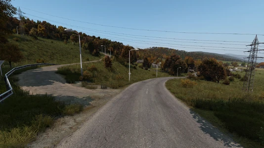 Road splitting off to the left leading to the SKVSCh Biathlon Arena.
