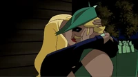 Black Canary and Green Arrow kiss