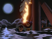 Batman saves Robin from the explosion