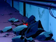Batman unconscious in the tunnels.