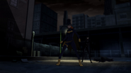 Batgirl and Catwoman saves Batman from street thugs.