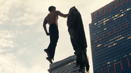 Superman lifts Batman