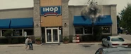 Superman and Faora-Ul crash through the Smallville IHOP