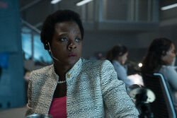 Amanda Waller worryingly watches the screen