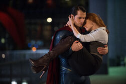 Superman carrying Lois Lane