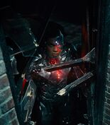 Cyborg stares out the smashed window - ZSJL.jpg