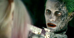 Joker holds a gun to Harley - David Ayer's Suicide Squad.jpg