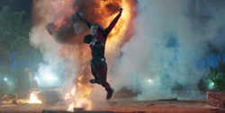 Harley jumps from an explosion.