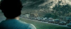 Clark watches as his father is killed by a tornado