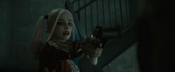 Harley points her gun at Deadshot