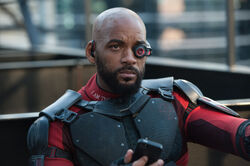 Deadshot talks to his employer promotional still