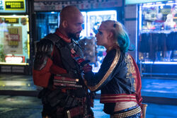 Harley Quinn approaches Deadshot