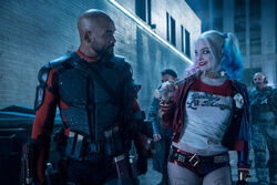 Deadshot and Harley Quinn eye each other up
