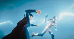 Young Flash and Supergirl working together