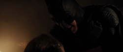 Batman shielding Martha