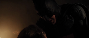 Batman shielding Martha