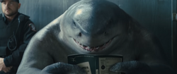 King Shark reads a book