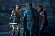 Batman stands with Wonder Woman and the Flash
