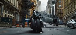 Batman using his batcycle 2