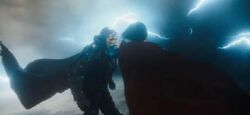 Supergirl punches Zod