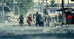 The Suicide Squad runs towards Starro