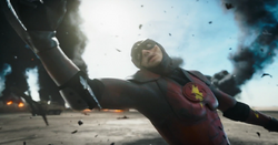 Young Flash's arm gets pierced by Kryptonian metal