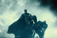 Batman stands on a gargoyle - ZSJL