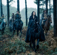 Diana Prince and company riding on horses