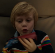 Unknown actor as Child on an Airplane (Scenes Deleted)