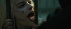 Quinn licking the bars.jpg
