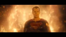 Superman stands in the flames at the Capitol