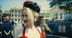 Harley Quinn thanks the butler for the welcome