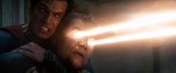Zod threatening to kill a family with his heat vision