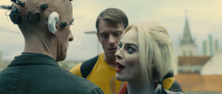 Harley Quinn threatens Thinker to cover his mouth