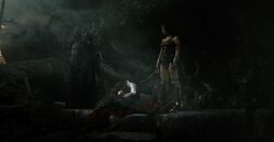 Batman and Wonder Woman stand over Lois cradling Superman's corpse