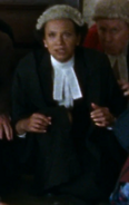 Grace Cookey-Gam as Old Bailey Lawyer