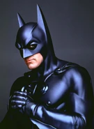 Batman portrayed by Michael Keaton, Val Kilmer and George Clooney in the Burtonverse.
