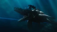 Orm charges against the submarine on his tylosaurus