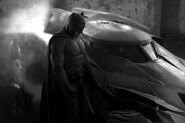 First look at Batman next to the Batmobile.